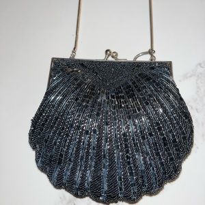 Lyrella black beaded bag. Inside pocket. Metal strap.